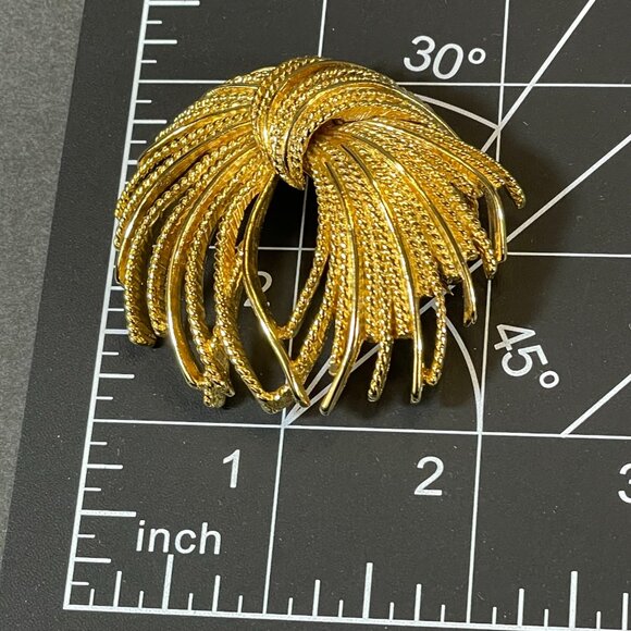 Monet Gold tone Mirador Brooch Pin Signed Vintage Burst Textured Tassel Rope Bow